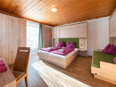 Ein Bett oder Betten in einem Zimmer der Unterkunft Mühlhof