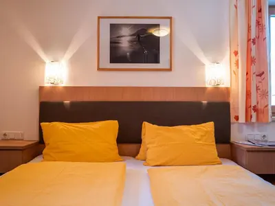 Ein Bett oder Betten in einem Zimmer der Unterkunft Mühlhof