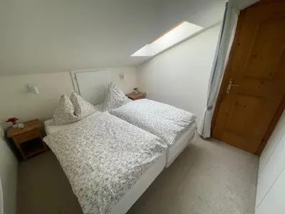Ein Bett oder Betten in einem Zimmer der Unterkunft CosyKitz Apartment