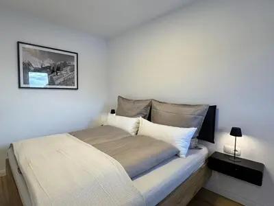 Ein Bett oder Betten in einem Zimmer der Unterkunft Lucy s Studio Apartment Kössen