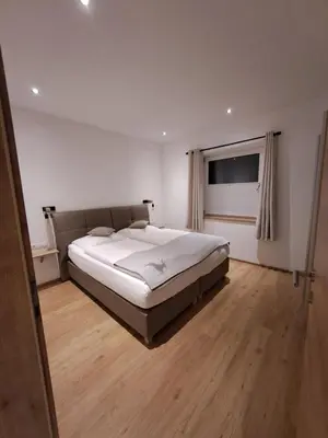 Ein Bett oder Betten in einem Zimmer der Unterkunft Panorama Appartements Filzerhof Weitblick & Sonnenseite