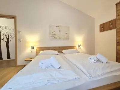 Ein Bett oder Betten in einem Zimmer der Unterkunft Chalet Noriker