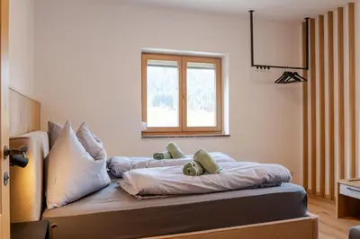 Ein Bett oder Betten in einem Zimmer der Unterkunft Alps Living Söll