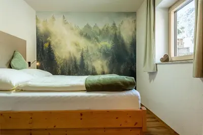 Ein Bett oder Betten in einem Zimmer der Unterkunft Karwendelnest