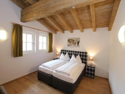 Ein Bett oder Betten in einem Zimmer der Unterkunft Modern chalet with sauna near ski area in Saalbach-Hinterglemm Salzburgerland