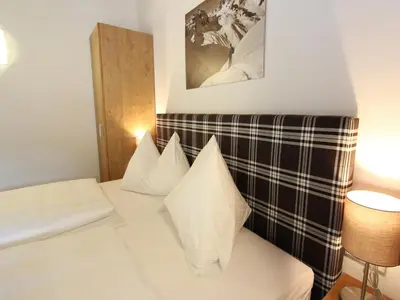 Ein Bett oder Betten in einem Zimmer der Unterkunft Modern chalet with sauna near ski area in Saalbach-Hinterglemm Salzburgerland