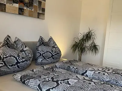 Ein Bett oder Betten in einem Zimmer der Unterkunft Lucy's Panorama Apartment