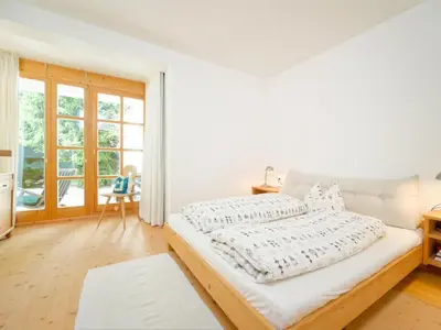 Ein Bett oder Betten in einem Zimmer der Unterkunft Chalet Talschluss 500 by Interhome