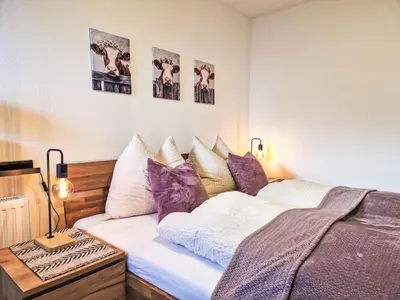 Ein Bett oder Betten in einem Zimmer der Unterkunft Apartment August by Interhome