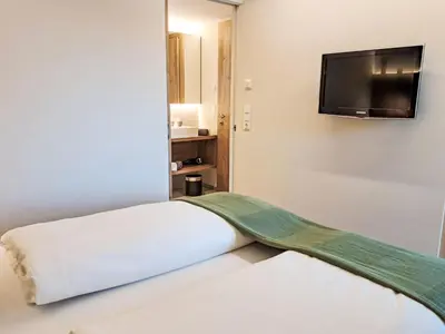 Ein Bett oder Betten in einem Zimmer der Unterkunft Apartment Aparthotel Iris-5 by Interhome