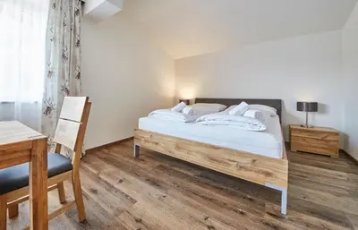 Ein Bett oder Betten in einem Zimmer der Unterkunft Appartement Haus Alexander, JOKERCARD INCLUDED