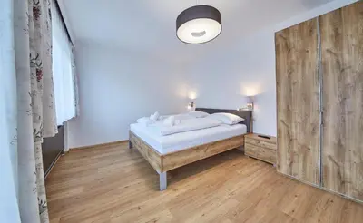 Ein Bett oder Betten in einem Zimmer der Unterkunft Appartement Haus Alexander, JOKERCARD INCLUDED