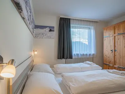 Ein Bett oder Betten in einem Zimmer der Unterkunft Hohe Tauern