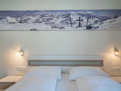 Ein Bett oder Betten in einem Zimmer der Unterkunft Hohe Tauern