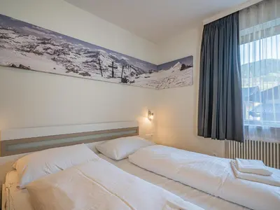 Ein Bett oder Betten in einem Zimmer der Unterkunft Hohe Tauern