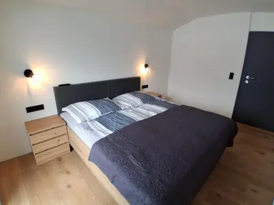 Ein Bett oder Betten in einem Zimmer der Unterkunft Zillerlehen