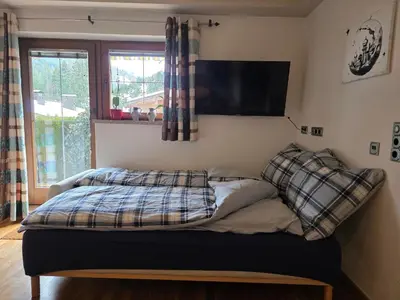 Ein Bett oder Betten in einem Zimmer der Unterkunft Feines Alpennest