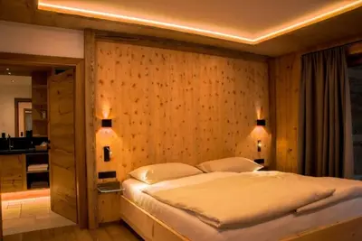 Ein Bett oder Betten in einem Zimmer der Unterkunft Chalet Residenz Mühlermoos - Chalet am Teich