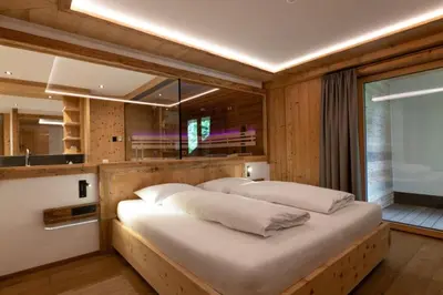Ein Bett oder Betten in einem Zimmer der Unterkunft Chalet Residenz Mühlermoos - Chalet Waldbühne