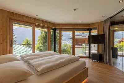 Ein Bett oder Betten in einem Zimmer der Unterkunft Chalet Residenz Mühlermoos - Chalet Bergkulisse