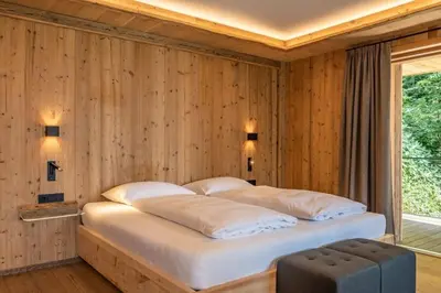 Ein Bett oder Betten in einem Zimmer der Unterkunft Chalet Residenz Mühlermoos - Romantik Chalet