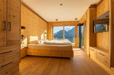 Ein Bett oder Betten in einem Zimmer der Unterkunft Chalet Residenz Mühlermoos - Chalet Mittendrin