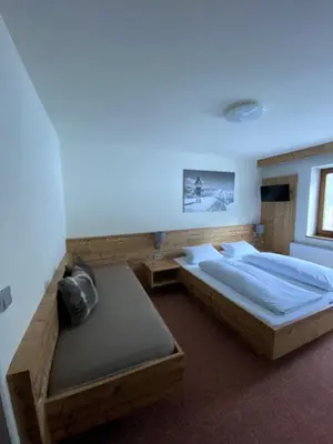 Ein Bett oder Betten in einem Zimmer der Unterkunft Strubwirt