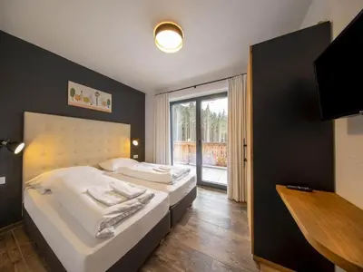 Ein Bett oder Betten in einem Zimmer der Unterkunft Chalet in Neukirchen by the Slopes