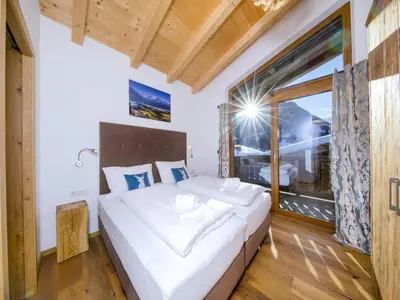 Ein Bett oder Betten in einem Zimmer der Unterkunft Family stay in Neukirchen with sauna