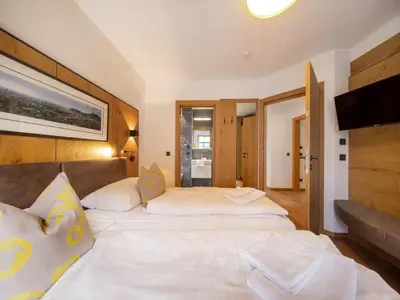 Ein Bett oder Betten in einem Zimmer der Unterkunft Wellness Chalet near Wildkogel