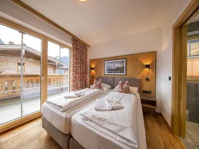 Ein Bett oder Betten in einem Zimmer der Unterkunft Wellness Chalet near Wildkogel