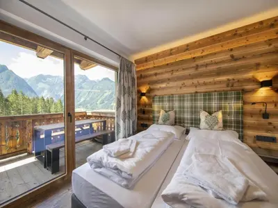 Ein Bett oder Betten in einem Zimmer der Unterkunft Chalet in Neukirchen near Anfängerpiste