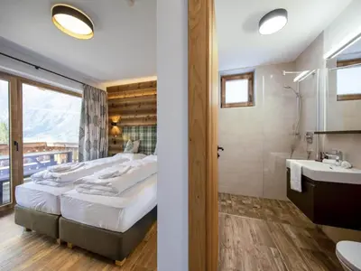 Ein Bett oder Betten in einem Zimmer der Unterkunft Chalet in Neukirchen near Anfängerpiste