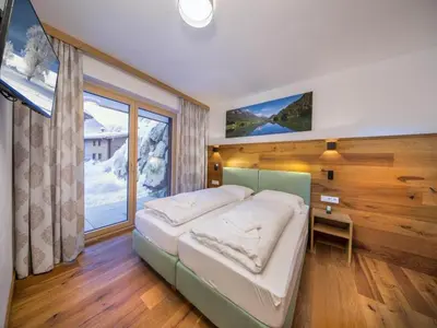 Ein Bett oder Betten in einem Zimmer der Unterkunft Chalet with Sauna Near Ski Bus