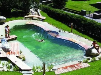Der Swimmingpool an oder in der Nähe von Apartment Wohnung Biohaus in Neukirchen am Großvenediger by Interhome