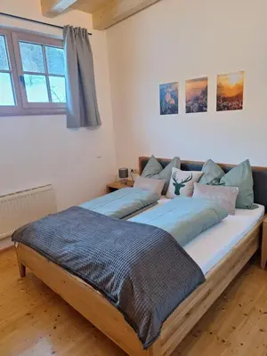 Ein Bett oder Betten in einem Zimmer der Unterkunft Winklern Appartment Wildschütz