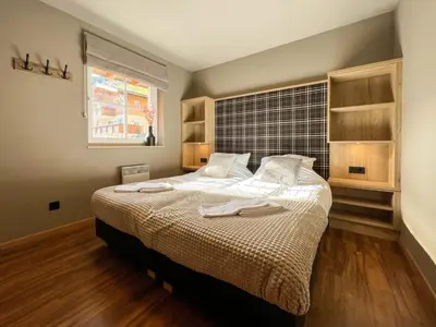 Ein Bett oder Betten in einem Zimmer der Unterkunft Alpen Resort Saalbach C3