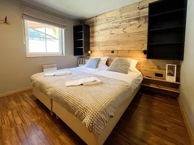 Ein Bett oder Betten in einem Zimmer der Unterkunft Alpen Resort Saalbach C3