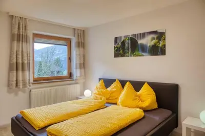 Ein Bett oder Betten in einem Zimmer der Unterkunft Apart Sunnseitn