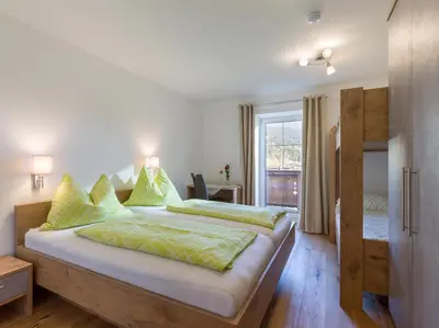 Ein Bett oder Betten in einem Zimmer der Unterkunft Mauerhof Ferienwohnungen am Bauernhof
