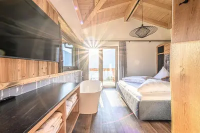 Ein Bett oder Betten in einem Zimmer der Unterkunft Alpinloft Goldsun