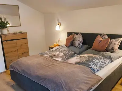 Ein Bett oder Betten in einem Zimmer der Unterkunft Apartment Mühlbach