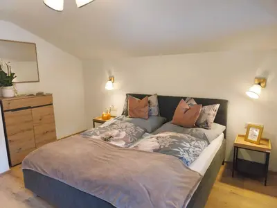 Ein Bett oder Betten in einem Zimmer der Unterkunft Apartment Mühlbach