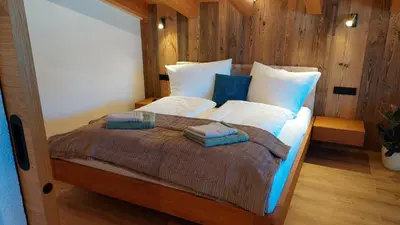 Ein Bett oder Betten in einem Zimmer der Unterkunft Apart M&M Michael und Maria