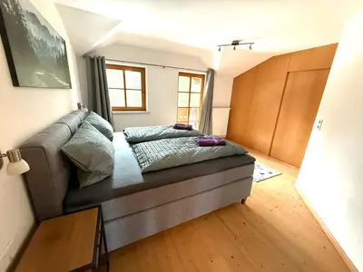 Ein Bett oder Betten in einem Zimmer der Unterkunft Ferienwohnung Leitacker im Kaiserwinkl