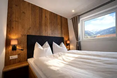 Ein Bett oder Betten in einem Zimmer der Unterkunft Bergzeit Appartment