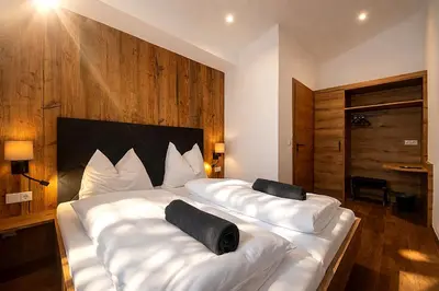 Ein Bett oder Betten in einem Zimmer der Unterkunft Bergzeit Appartment