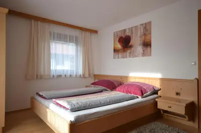 Ein Bett oder Betten in einem Zimmer der Unterkunft Ferienhaus Raffeiner