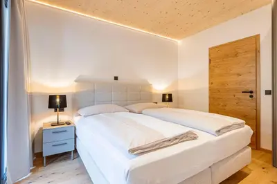 Ein Bett oder Betten in einem Zimmer der Unterkunft Saalbach Suites Private Spa by ALPS RESORTS