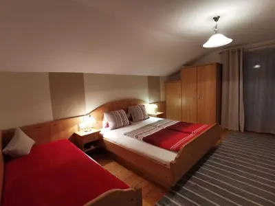 Ein Bett oder Betten in einem Zimmer der Unterkunft Gästehaus Jogglerhof